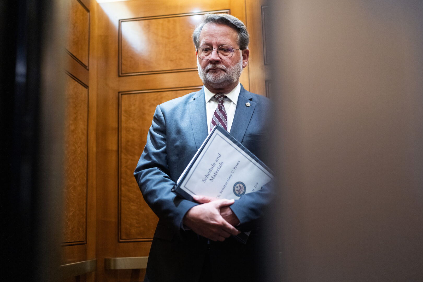 Sens. Gary Peters, seen here in July, and James Lankford are proposing a public-facing tracker to  keep tabs on Senate-confirmed positions. 