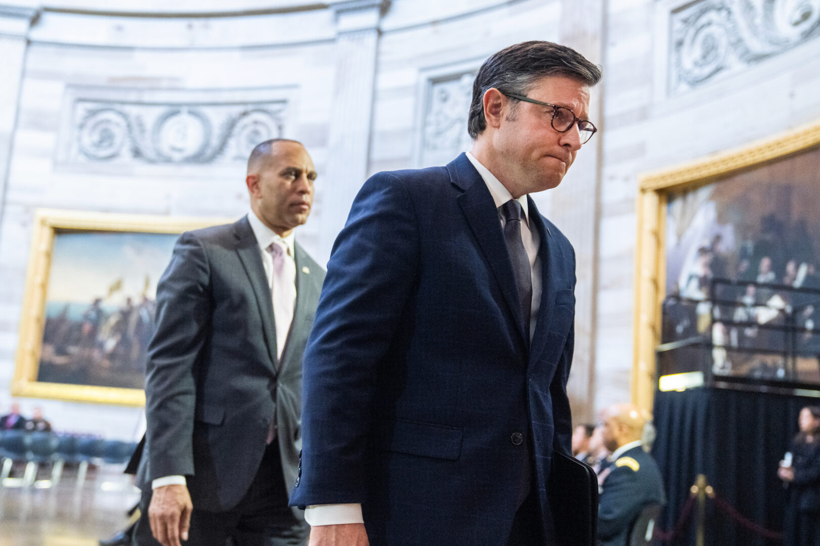 Speaker Mike Johnson, R-La., right, and House Minority Leader Hakeem Jeffries, D-N.Y., attend a ceremony in the Capitol rotunda on Monday. 