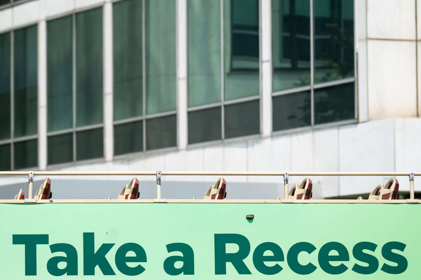 A tour bus with an advertisement for a stress relief supplement drives on North Capitol Street in Washington on Wednesday. Congress is once again set to take its annual August break.