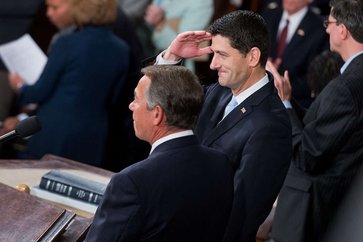 Rep. Paul D. Ryan, right, stands with outgoing Speaker John A. Boehner before Ryan was sworn in on the House floor as the 54th speaker on Oct. 29, 2015.