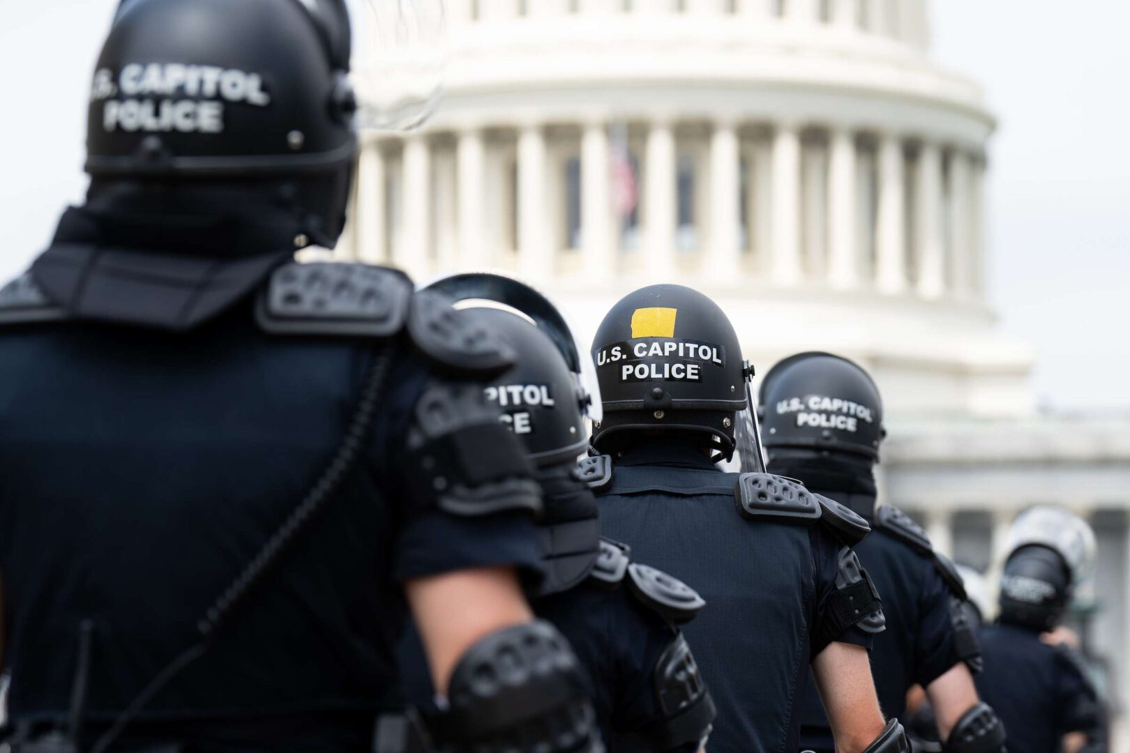 Capitol Police return to their staging area after clearing a path to the Capitol for House Democrats  after they spoke outside of the Supreme Court after the abortion decision.