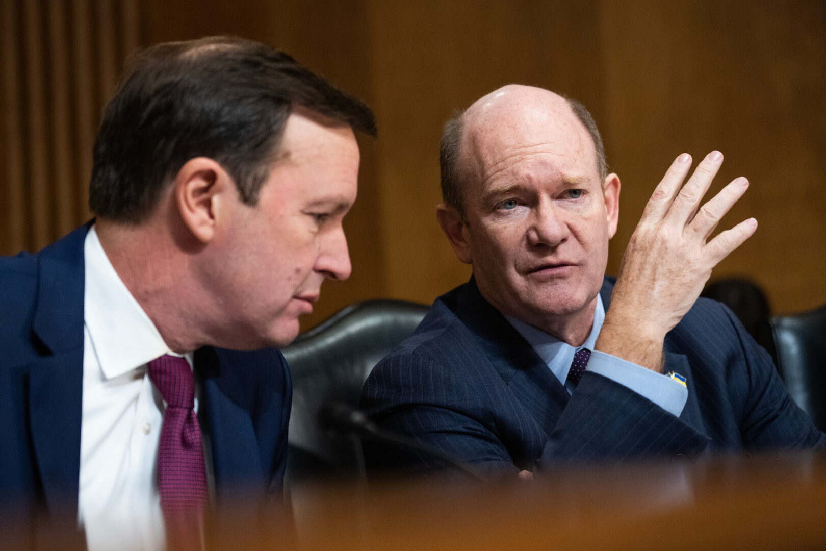 Sens. Chris Coons, D-Del., right, and Christopher S. Murphy, D-Conn., attend a Senate Foreign Relations Committee hearing on  Jan. 25. 