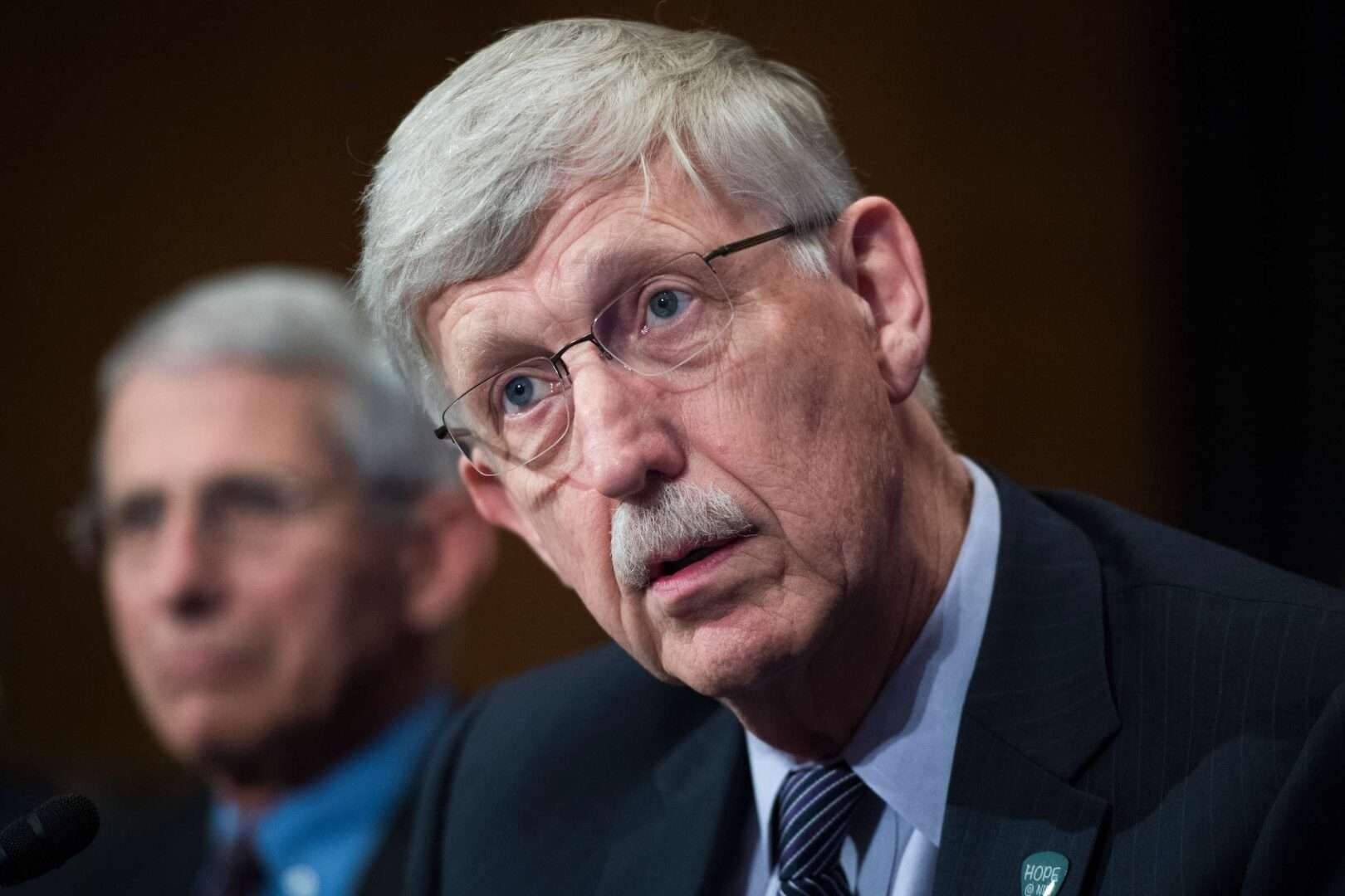 The departure of Dr. Francis Collins, right, director of the National Institutes of Health, and Dr. Anthony Fauci, director of the National Institute of Allergy and Infectious Diseases, has led to worries about key vacancies at NIH during a crucial period for the agency.