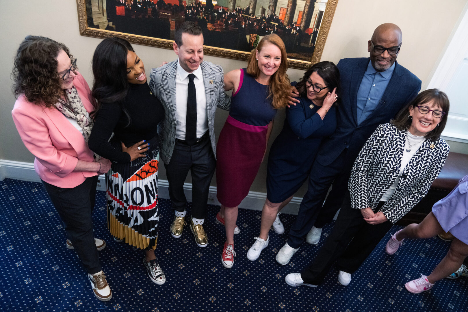 From left, Reps. Val Hoyle, Jasmine Crockett, Jared Moskowitz, Melanie Stansbury, Lori Chavez-DeRemer and Andrea Salinas pose with footwear designer D’Wayne Edwards during a Congressional Sneaker Caucus event on Wednesday.