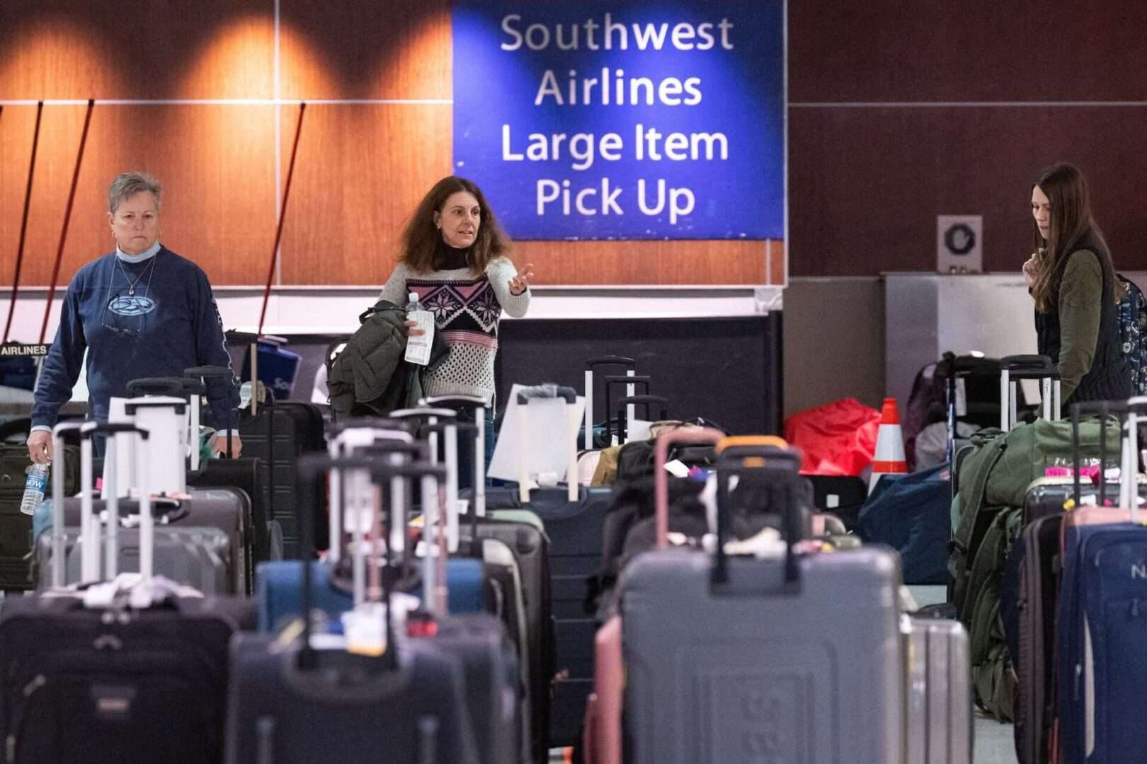 Southwest Airlines passengers search for their luggage in baggage claim at Baltimore-Washington International Airport last month after the airline canceled more than 70 percent of flights over the holidays.