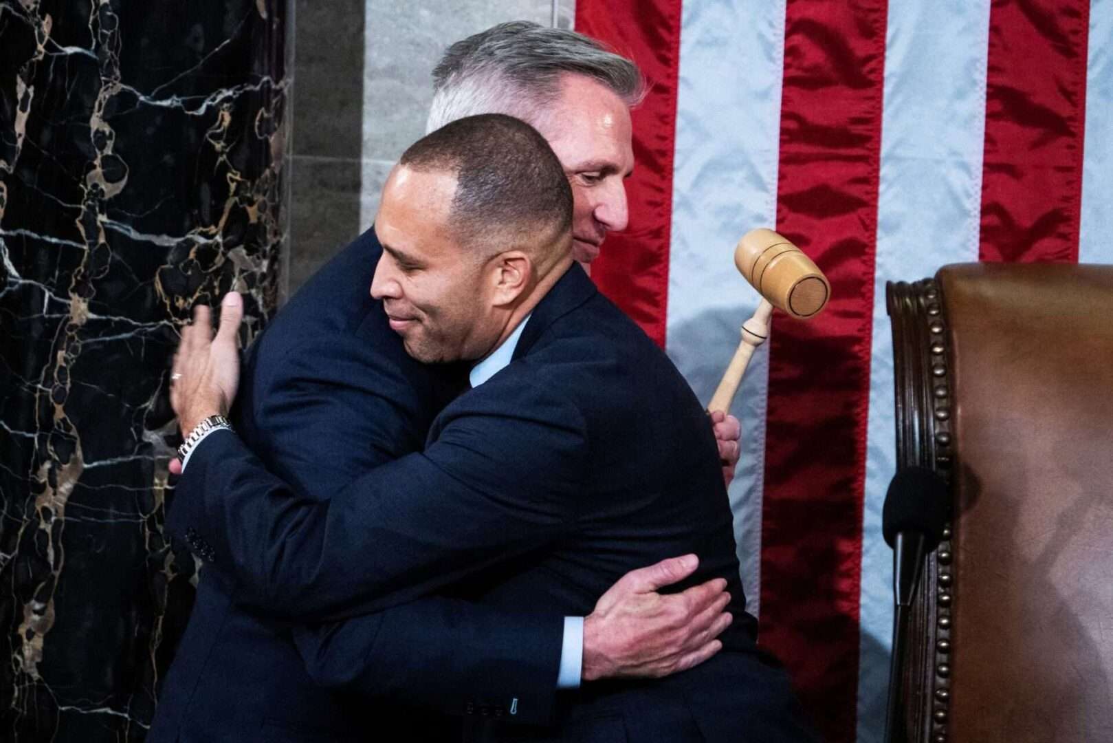 Speaker Kevin McCarthy accepts the gavel from Minority Leader Hakeem Jeffries early Saturday after McCarthy won the speakership on the 15th ballot. 