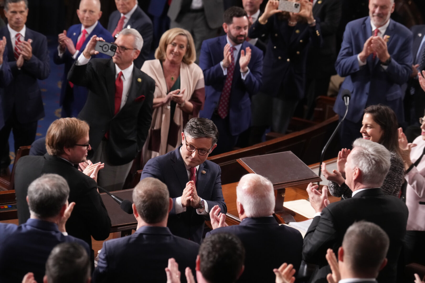 Mike Johnson responds to colleagues on the floor during Wednesday’s session electing him as speaker.