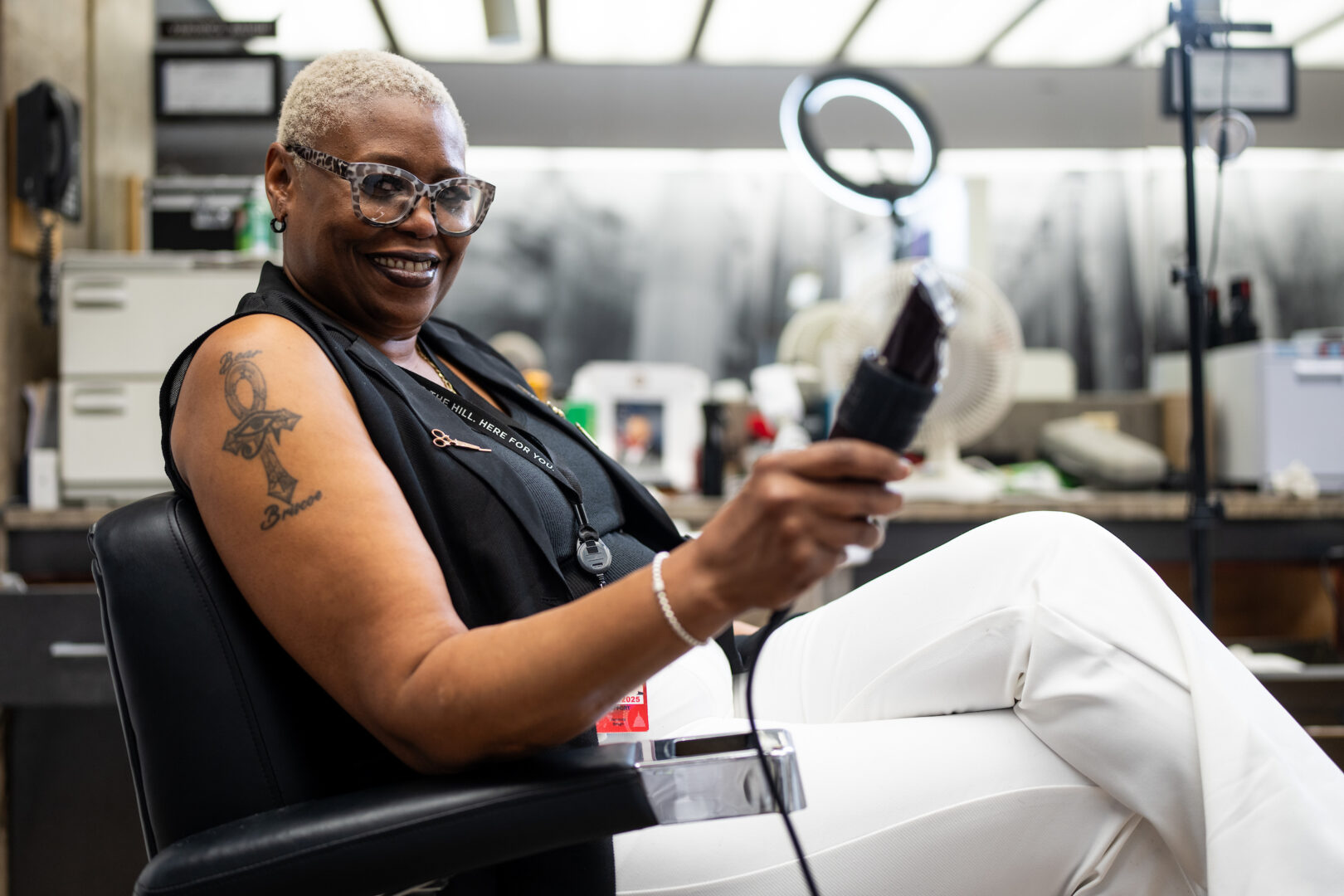 Veronica Baugh sits in the House barbershop in the Rayburn Building on May 22. 