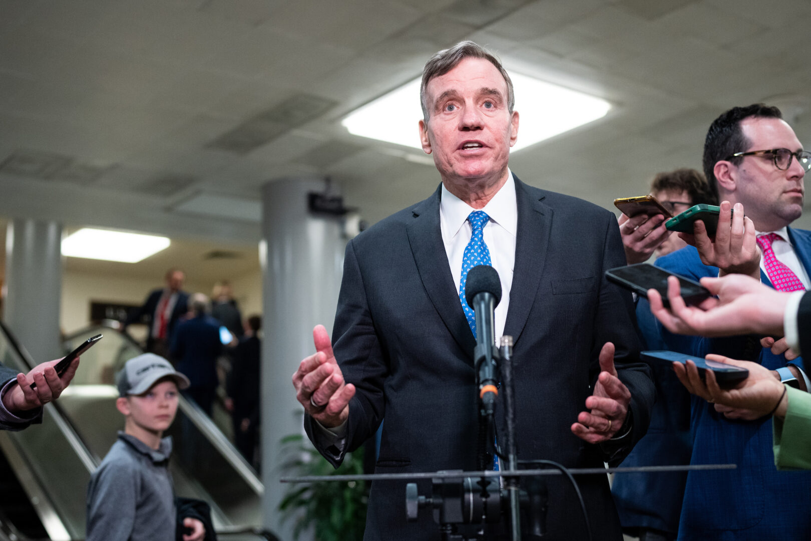 Senate Intelligence Chairman Mark Warner, D-Va., speaks to reporters as he leaves a TikTok briefing in the Capitol on March 20.