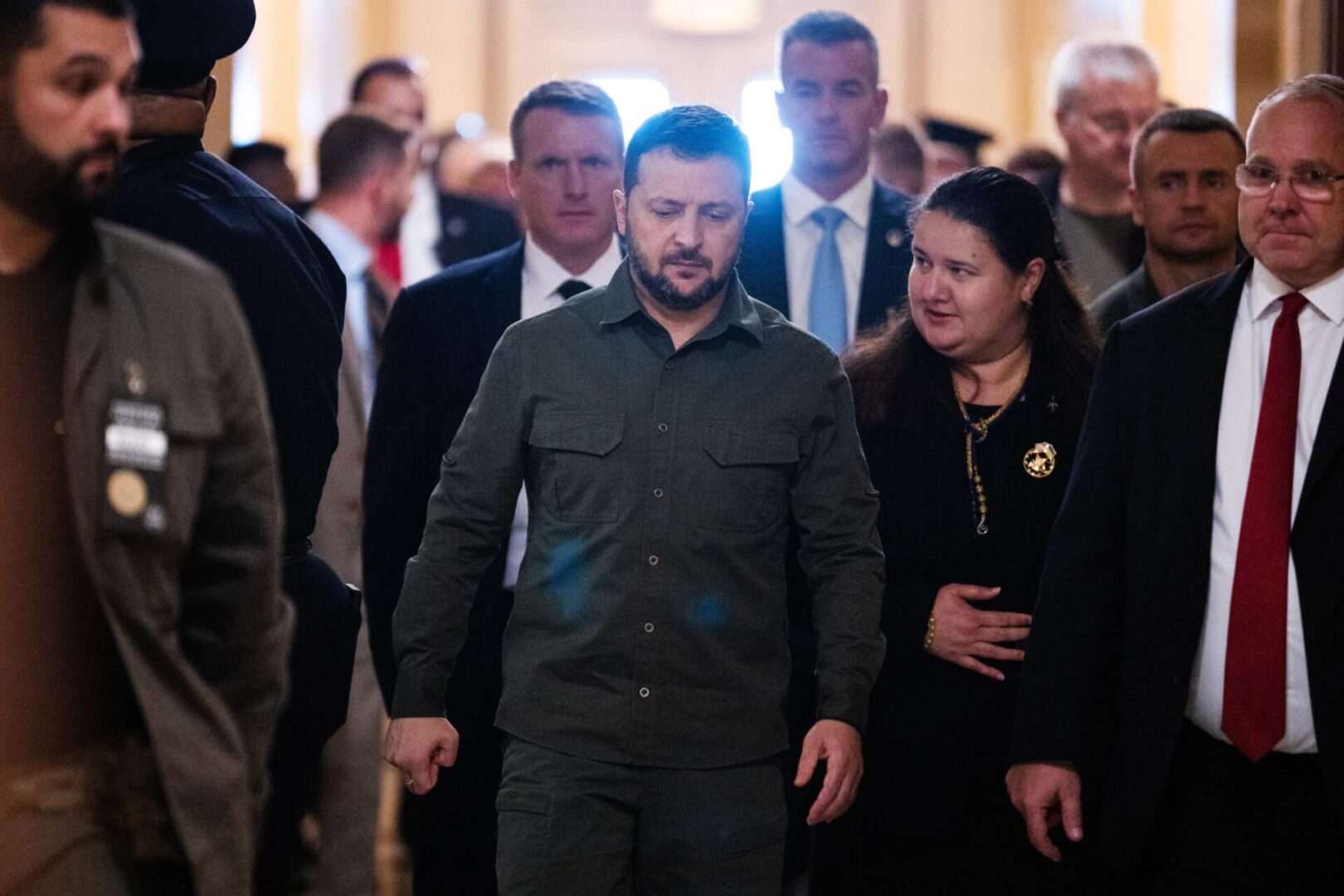 Ukrainian President Volodymyr Zelenskyy and Ukrainian Ambassador to the U.S. Oksana Markarova, right, leave a meeting with House members in the Capitol on Thursday. 