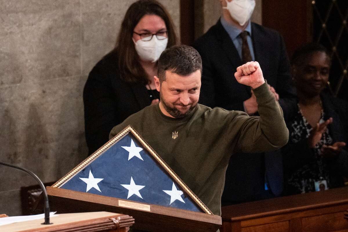 Ukraine President Volodymyr Zelenskyy raises his fist after exhanging flags with House Speaker Nancy Pelosi at the end of his address to a joint meeting of Congress in the Capitol on Wednesday.